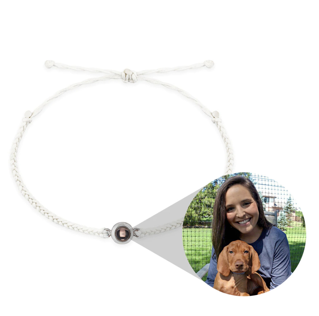 Real white woven projection bracelet shown with a person and dog photograph reveal