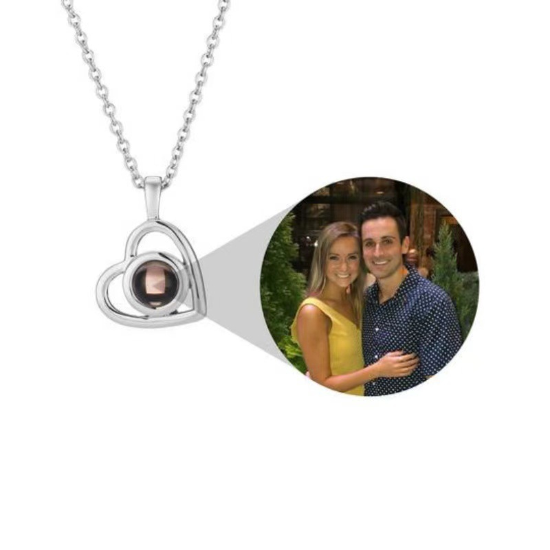 Real twin-heart projection necklace shown with a couple photograph reveal
