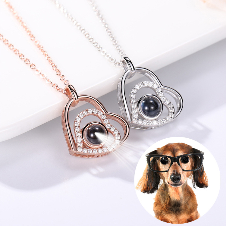 Real crystal-set heart projection necklaces shown with a dog photograph