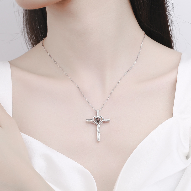 Real Angel Cross projection necklace worn close to the heart